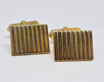 Gold tone cuff links