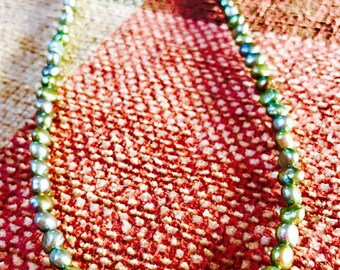 String of green fresh water pearls.