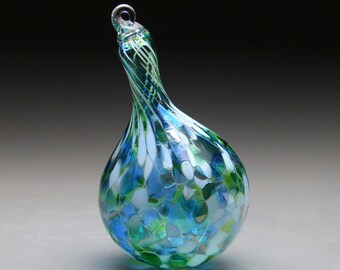 hand made blown glass teardrop Christmas ornament in tones of green, blue, opal light blue, splash.