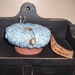 Blue and White Floral Pin Keep in Rusty Tin Lid