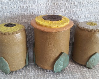 Pottery salt and pepper shakers with sugar jar