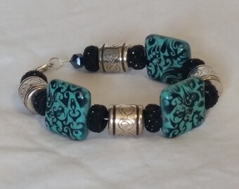 Turquiose square beads with black accents