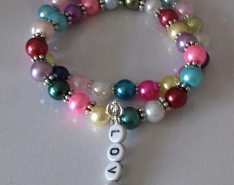 Stretch bead bracelet with love charm