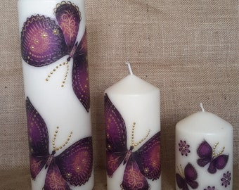 Set of three unscented decoupage candles.