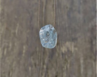 Rough aquamarine necklace. Raw icy blue aquamarine necklace on a brown silk thread. Rough slice aquamarine necklace. March Birthstone.