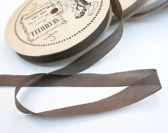 Spool of vintage rayon seam binding. Seamwell, mid century, brown, sewing supplies, crafting.