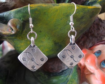 Dangling diamond earrings silver