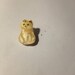 Moon glow glass cat button.