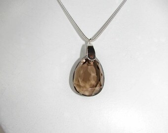 25.00 faceted smoky Quartz pendant mm on silver chain.
