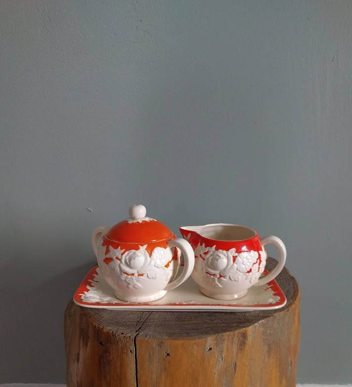 vintage floral sugar and creamer set in orange and white