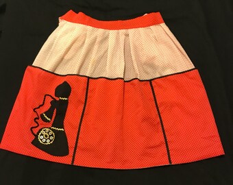 Retro vintagered and white polka dot half apron with nostalgic telephone patch