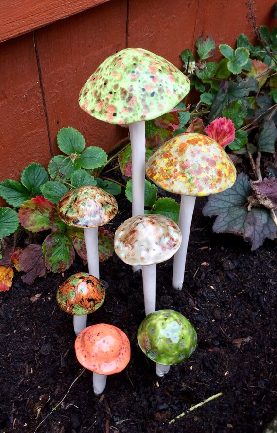 Seven hand crafted ceramic mushrooms 1 extra large 1 large