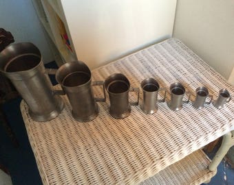 Set of 7 pewter measures English immaculate condition