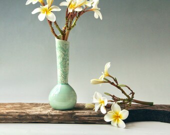 Teal bud vase with Australian Flannel flower design
