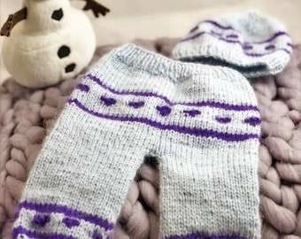 Knitted trousers with cap for a baby