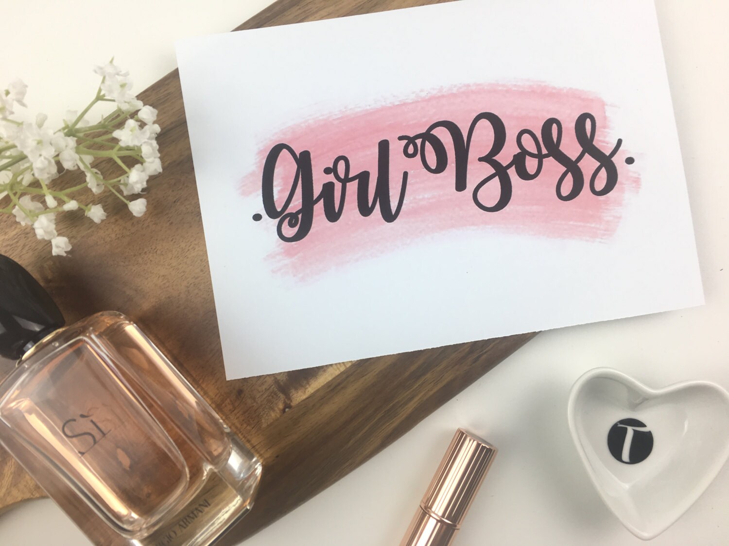 Girl Boss quote on pink watercolour brush stroke background