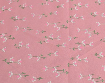 White Flowers on Pink Sheer Polyester Fabric
