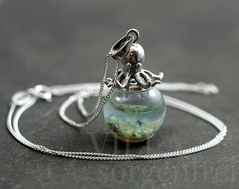 Sterling octopus seawater necklace. 925 sterling octopus carrying glass orb filled with seawater and tiny pebbles. Sterling necklace.