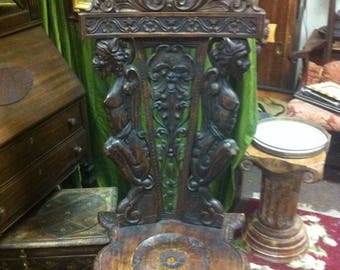 Vintage Renaissance Revival Chair Decorated with Hand Carved Demons and Floral Flourishes
