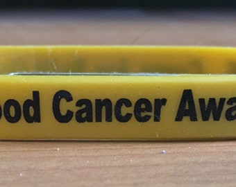 Childhood cancer awareness silicone bracelet.