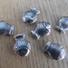 Tibetan style bead in the shape of "fish" 14 x 10 mm metal color: antique silver.