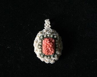 Vintage white beaded and celluloid carved coral pendant