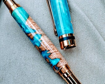 Classic Elite 24k gold rollerball pen wrapped in a choice of wood, acrylic , or hybrids.