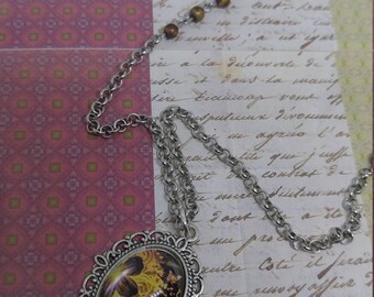 Firefly - 18x25 oval antique silver cabochon necklace with brown and yellow firelike flowers