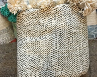 wool blanket with pom poms hand loomed in morocco