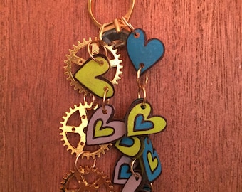 Hearts and gears shrink art charm necklace in gold