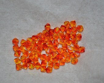 24 - 4mm Genuine Swarovski Crystal Bicone Beads - Fire Opal