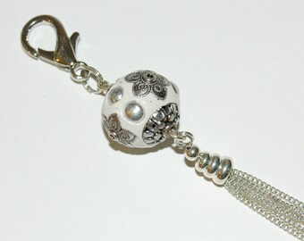 Bag of white and silver polymer clay charm
