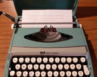 1970's turquoise Smith Corona Corsair Deluxe ultra portable typewriter