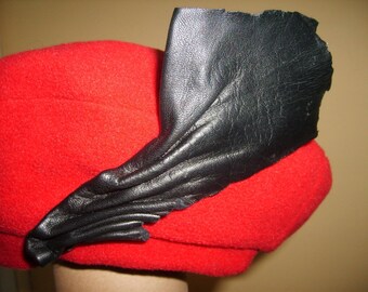 Red leather fleece beret draped black