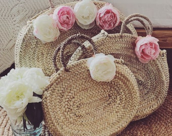 Oval basket has 4 peonies