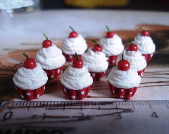 Set of 3 Red cupcakes has white polka dots decorated with a pretty cherry