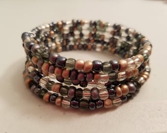 Gray, champagne and silver beads coil bracelet