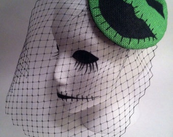 Green and black Boogie man fascinator hat. Portion of sale goes to charity.