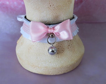 White pleated collar with pink accents