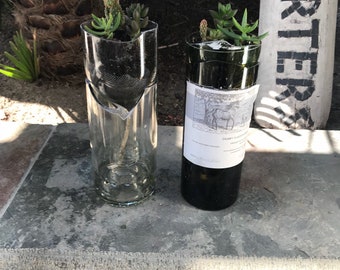 Self watering succulent planters made out of recycled wine bottles