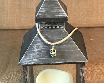 Brown-suede-choker-with-green-skull-pendant