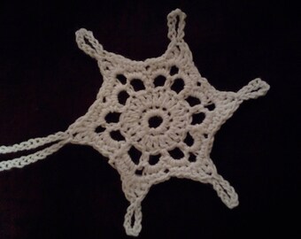 Six crocheted snowflakes