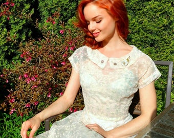vintage 1950s sheer, baby pink, floral patterned dress with drop waist