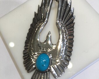 925 Silver Eagle pendant and turquoise stone.