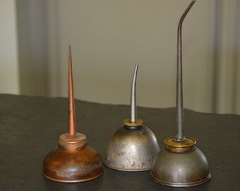 Vintage Thumb Oil Cans