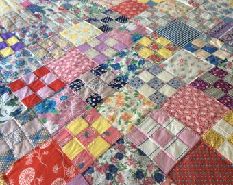 Quilt for sale! 1930's vintage feedsack quilt. Mostly feedsacks with some dress fabric. Measures 70"x 90". Completely finished.