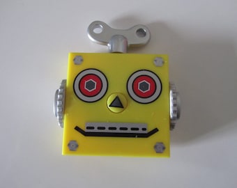 Little yellow robot containing a retractable measuring tape