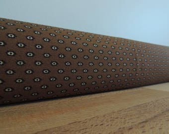 Brown draft Stopper. Light blocker. Door or window snake. Draught excluder. House and home accessory. energy saver. window draft stopper.