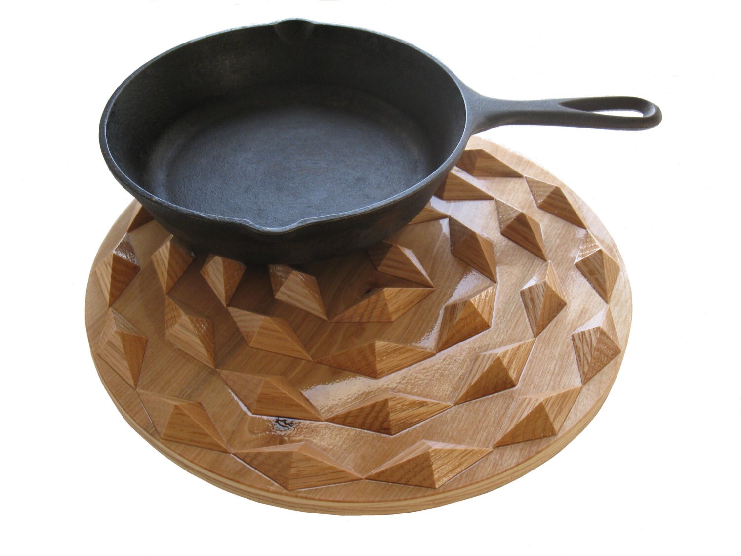 Spiral wood hot pad. Round wooden trivet with wood spirals.