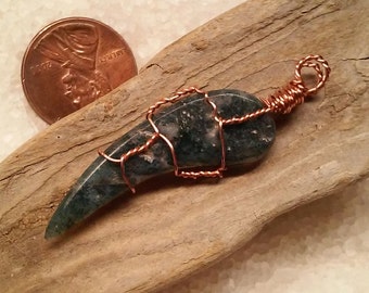 Wire wrapped stone claw pendant